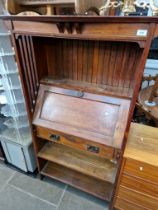 An Edwardian Arts & Crafts oak bureau bookcase.