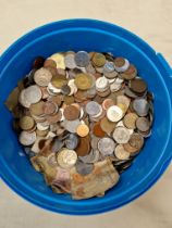 A tub of world coins and banknotes
