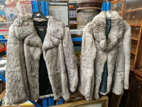 Two fur jackets.