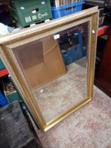 A gilt framed mirror and two folding card tables.