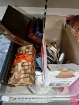 A box of boxed cutlery sets, loose cutlery, coasters etc