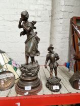 Two spelter figures, one of a lady and the other of a French Cavalier