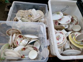 Three plastic crates of trios - cups, saucers and plates - various makers