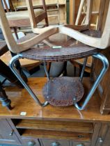 An Art Deco chrome and bakelite circular coffee table.