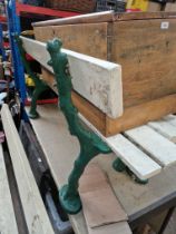 A heavy duty garden bench on cast supports