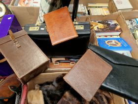 A box with a leather briefcase, leather instrument case, wallets, attached case etc