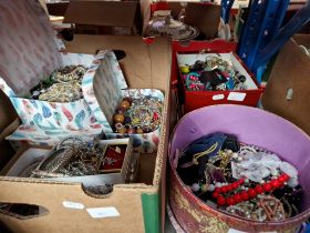 A box and 2 tubs of costume jewellery.