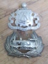 Two badges: Sharpe Stewart locomotive and a Sunderland Trams.