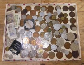 A tray of assorted UK & world coins and banknotes to include commemorative coins etc.