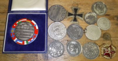 Assorted medals and commemorative medallions including a German WWII Iron Cross, etc.