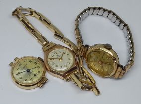 A group of three 9ct gold watches, two with gold plated straps.