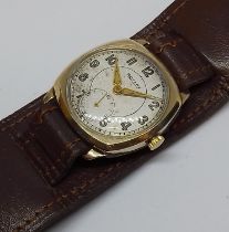 A 9ct gold Rotary wristwatch, case width 29mm, military style leather strap.