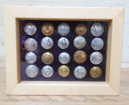 A display case of 20 mainly British municipal transport buttons, some possible police.