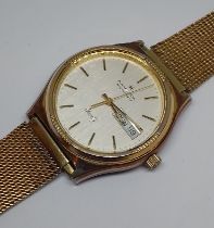 A Hamilton Masterpiece gold plated quartz wristwatch, case diam. 36mm, later gold plated strap.