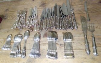 A quantity of silver flatware, eight place setting comprising eight teaspoons, eight soup spoons,