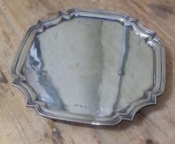 A four footed silver salver, Alexander Clarke & Co Ltd, Birmingham 1913, width 30.5cm., wt. 27.6ozt.