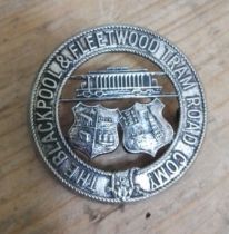 A Blackpool & Fleetwood Tram Road Company badge.