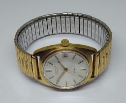 A gold plated Longines automatic wristwatch.