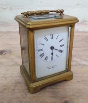 A gilt brass carriage clock, white enamel dial signed Henry Wells, Shrewsbury.