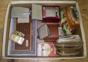 A box of assorted vintage lighters.