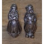 A pair of Dutch imported silver salt and pepper pots modelled as a man a woman, height 7cm,
