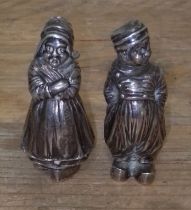 A pair of Dutch imported silver salt and pepper pots modelled as a man a woman, height 7cm,