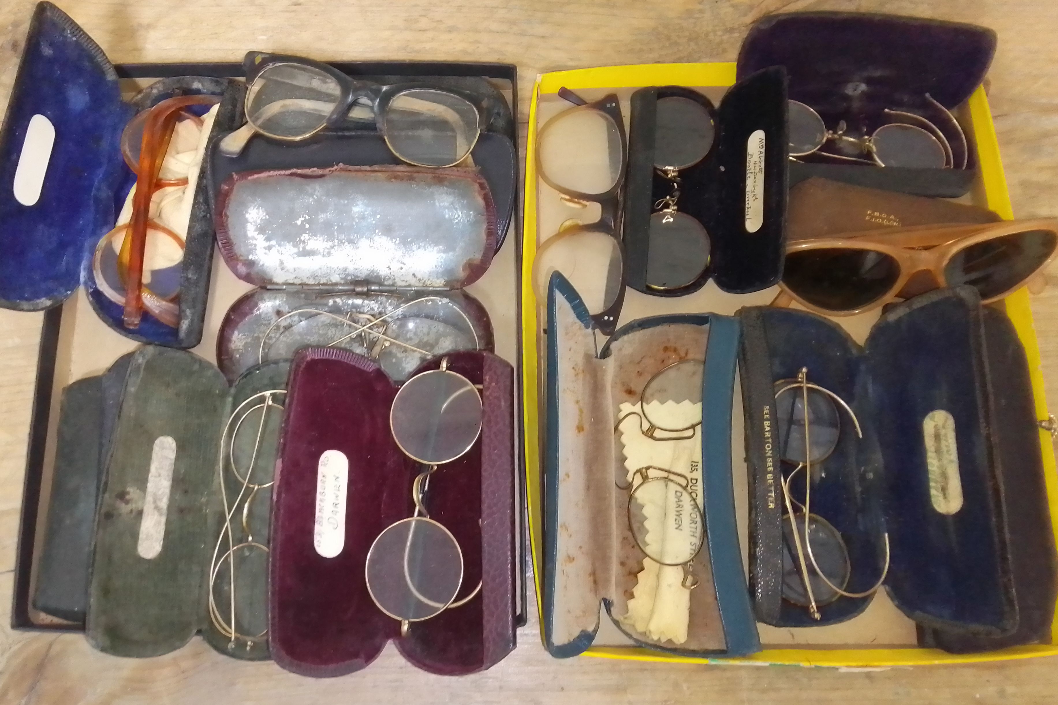 Twelve pairs of vintage spectacles.