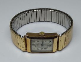 A hallmarked 9ct gold Art Deco style wristwatch, gold plated flexi strap.