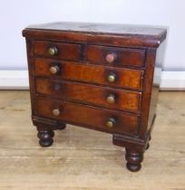 A Victorian 'apprentice' chest of drawers, height 23cm.