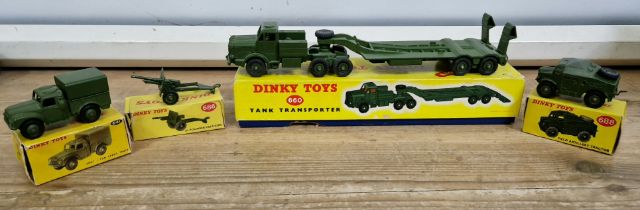 A group of four boxed Dinky toys comprising a tank transporter 660, 25-pounder field gun 686, army