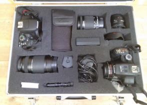 TWo digital cameras; Canon 700D and Lumix FZ150, boxed with accessories.