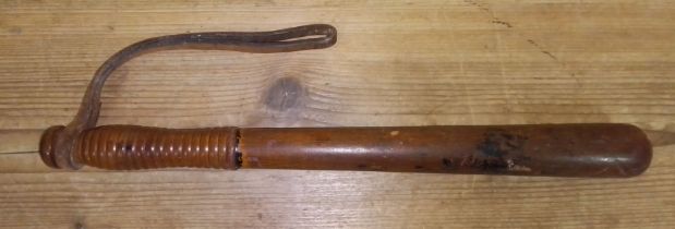 A wooden truncheon, length 40.5cm.