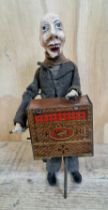 A vintage S.I.J.I.M. musical tin toy, the organ player, 22cm height.