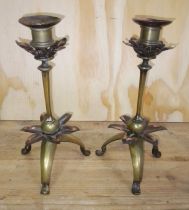 A pair of Arts & Crafts copper and brass candlesticks in the manner of WAS Benson, height 23cm.