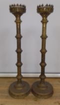 A pair of large church brass candlesticks, height 90cm.