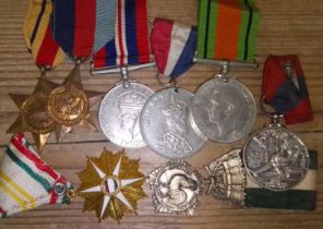 Assorted medals and badges.