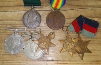 Assorted WWI & WWII medals comprising a Long Service awarded to 1799 SJT. C.B. Capstick. 2/V.B.