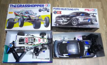 Two Tamiya RC model cars; Grasshopper and Ford Mustang GT4