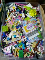 A box of assorted lego friends including some booklets.
