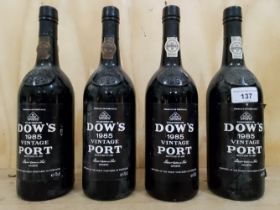 Four bottles of Dow's 1985 vintage port, some seepage to two of the bottles, levels good.
