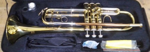 An Elkhart 100TR trumpet with hard case.