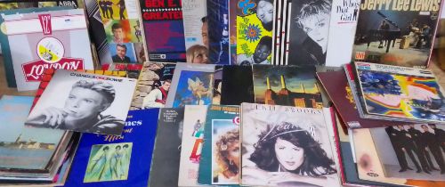 A box of assorted records.