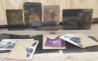 A tin of assorted photography glass negatives including team photographs, servicemen etc.