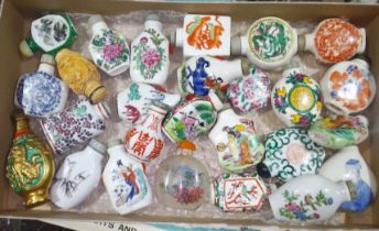 A collection of approx. 26 Chinese snuff bottles, mainly porcelain, also including cinnabar lacquer,