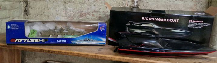 A boxed R/C stinger boat & a Boxed R/C HT-3827 Battleship 1/360 Scale.