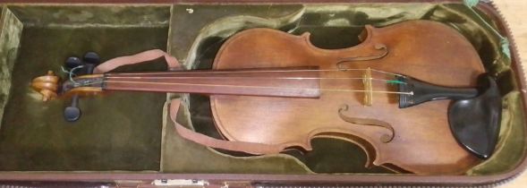 An antique violin with hard case.