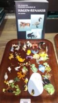 A tray of Hagen-Renaker California miniature animals with a book.