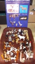 A tray of Hagen-Renaker California miniature animals with a book.