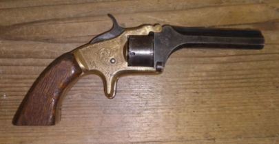 A late 19th century 5mm 7 shot revolver, length 17.5cm.