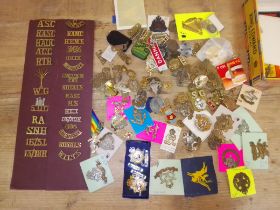 A quantity of mainly cap badges and lapel badges, other collectables.